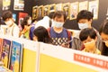18 07 2021 People with face masks read and buy books in Hong Kong Book Fair in Hong Kong Convention and Exhibition Center , Wan Royalty Free Stock Photo