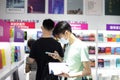 18 07 2021 People with face masks read and buy books in Hong Kong Book Fair in Hong Kong Convention and Exhibition Center , Wan Royalty Free Stock Photo