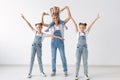 People, family and children concept - portrait of a lovely mother having fun with her twin daughters and baby girl on Royalty Free Stock Photo