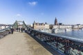 People at Famous Eiserner steg with love locks over the river Ma