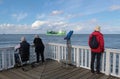 People on the famous viewing platform Alte Liebe in Cuxhaven, Germany.