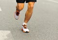 People feet on city road in marathon running race Royalty Free Stock Photo