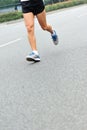 People feet on city road in marathon running race Royalty Free Stock Photo