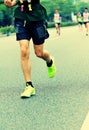 People feet on city road in marathon running race Royalty Free Stock Photo