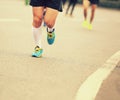 People feet on city road in marathon running race Royalty Free Stock Photo