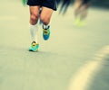 People feet on city road in marathon running race Royalty Free Stock Photo