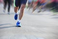 People feet on city road in marathon running race Royalty Free Stock Photo