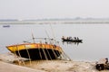 People are ferried across the river Ganges in old Royalty Free Stock Photo