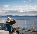 People on a ferry. Passengers on excursion ship or ferry on holiday boat trip in tourism and vacation travel concept