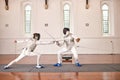 People, fighting and fencing with a sword in competition, duel or combat with martial arts fighter and athlete with a Royalty Free Stock Photo