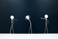 People figures pointing fingers on a scared stick man on a dark background. Bullying, victim blaming, accusation and abuse concept