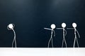 People figures pointing fingers on a scared stick man on a dark background. Bullying, victim blaming, accusation and abuse concept