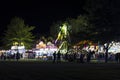 People figures in silhouette enjoying concessions and rides at the state fair in a park in Carson City Royalty Free Stock Photo