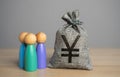 People figurines and chinese yuan or japanese yen money bag. Royalty Free Stock Photo