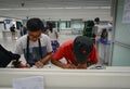 People fill the form paper at airport in Kolkata, India