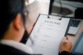 People are filling out their resume on the job application form to apply for a job at a company Royalty Free Stock Photo