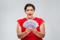 Happy woman holding thousands of money banknotes Royalty Free Stock Photo