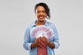 Happy african american woman holding euro money Royalty Free Stock Photo