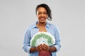 Happy african american woman holding euro money Royalty Free Stock Photo