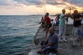 People fish in Black sea from landing stage