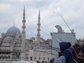 People fish from the Galata bridge in Istanbul. The bridge is well known for rod fishing at sunset. Royalty Free Stock Photo