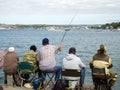 People fish from the pier of the Grafskaya pier, Sevastopol, Crimea Royalty Free Stock Photo