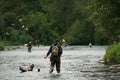 Three anglers in the Russian river. Royalty Free Stock Photo