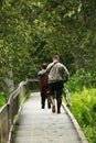 A young guy and a man walking along the river with fish. Anglers in the Russian river Alaska Royalty Free Stock Photo