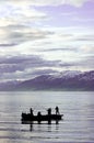 People fishing on fjord