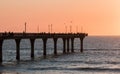 People are fishing on a pier at sunrise Royalty Free Stock Photo