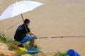 people fishing recreationally by the river Royalty Free Stock Photo