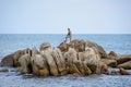 People fishing on a rocky beach