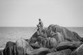 People fishing on a rocky beach