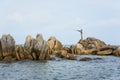 People fishing on a rocky beach