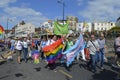 People with flags and banners join in the colourful Margate Gay pride Parade