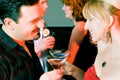 People flirting and drinking in a bar Royalty Free Stock Photo