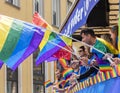 People on a float holding rainbow flags and attending the Gay Pride parade also known as Christopher Street Day CSD in Munich