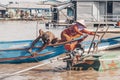 People of floating village on the lake Tonle Sap in Cambodia 2019-12-27. Royalty Free Stock Photo