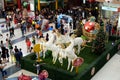 People flock at Styrofoam statue of white Unicorn horses pulling golden spherical carriage