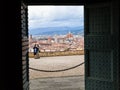 People and Florence city through gate of Basilica Royalty Free Stock Photo