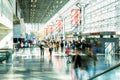 People flow through the concourse of the Javitz Center