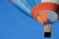 People fly in hot air balloon over the old town in Vilnius, Lithuania.