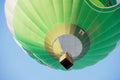 People fly in hot air balloon over the old town in Vilnius, Lithuania.