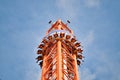 People free falling from tower ride at amusement park. Free Fall Tower in the amusement park. Royalty Free Stock Photo