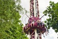 People free falling from tower ride at amusement park. Famous adrenaline attraction Royalty Free Stock Photo