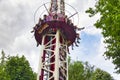 People free falling from tower ride at amusement park. Famous adrenaline attraction Royalty Free Stock Photo