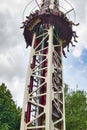 People free falling from tower ride at amusement park. Famous adrenaline attraction Royalty Free Stock Photo