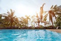 People friends jumping to the swimming pool, beach holidays Royalty Free Stock Photo