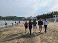 People and friends walking along families on the beach of Macau called aksa beach