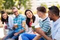 Friends drinking coffee and juice talking in city Royalty Free Stock Photo